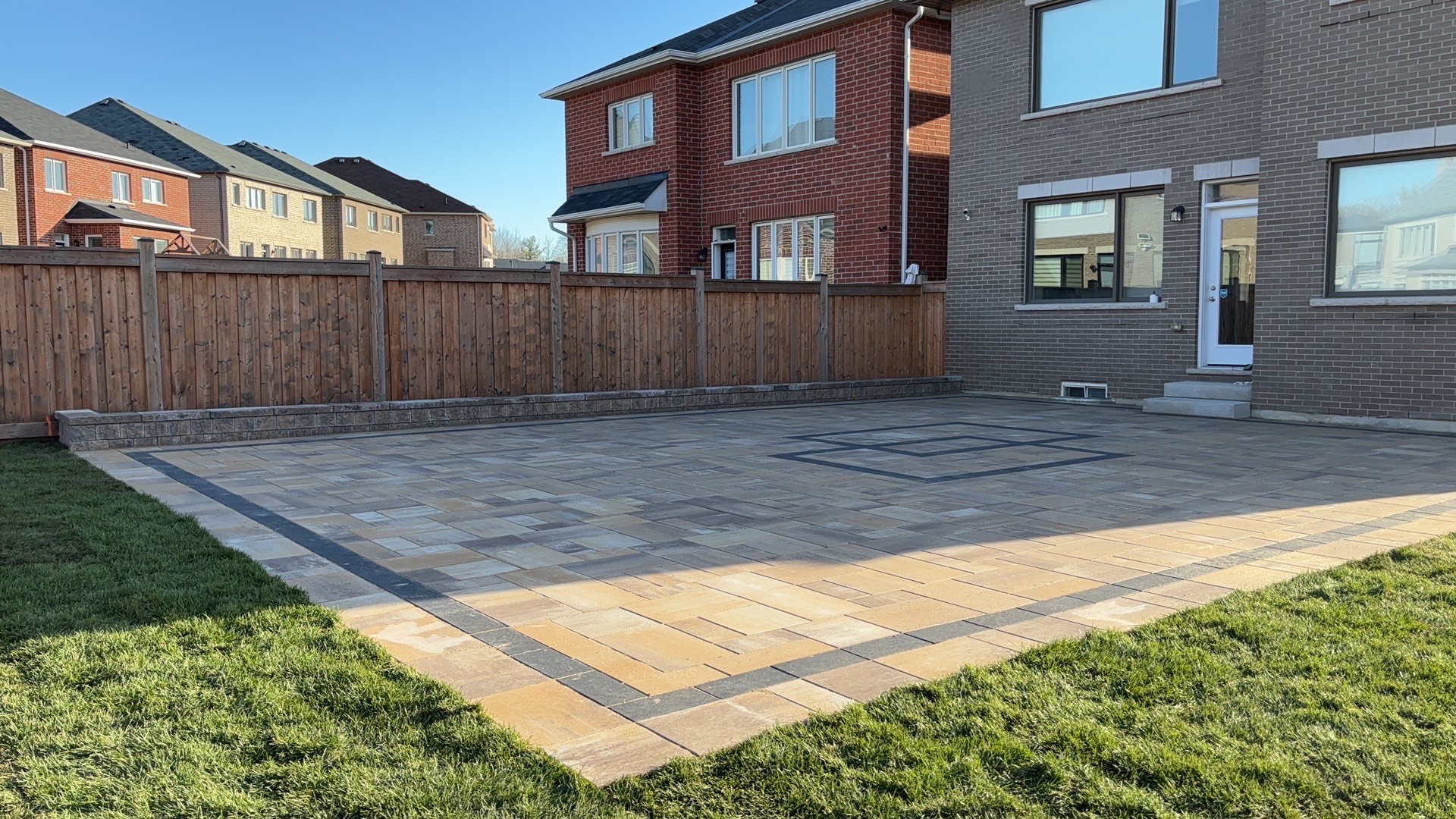 Large residential interlocking patio with decorative border in the GTA